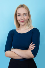 beautiful blond woman against blue background