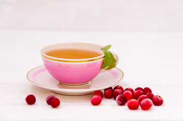 A cup of tea and cranberries