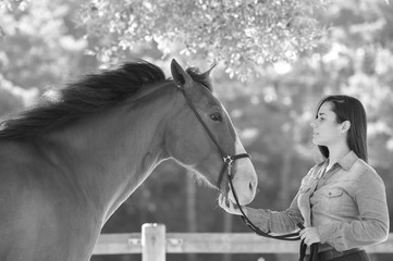 Woman and his horse, equestrian center