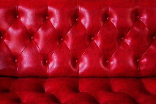 Red sofa leather texture and background.