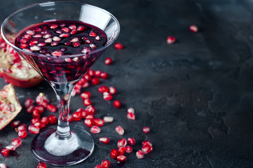 pomegranate cocktail and ripe red pomegranate fruit