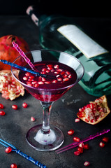 Pomegranate martini with pomegranate seeds in a glass