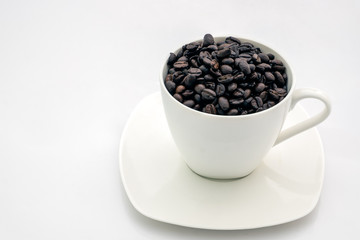 Black coffee beans in white cup on white background, healthy concept, Filtered process, Selective focus.