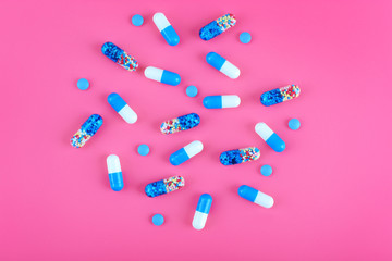 Color pills on pink background