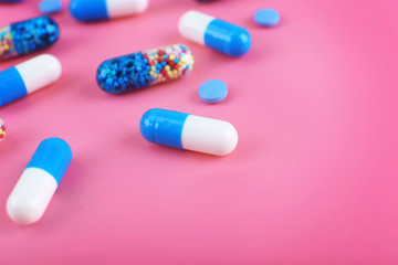 Color pills on pink background