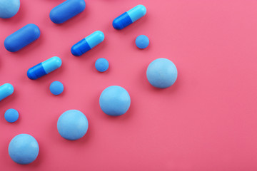 Color pills on pink background