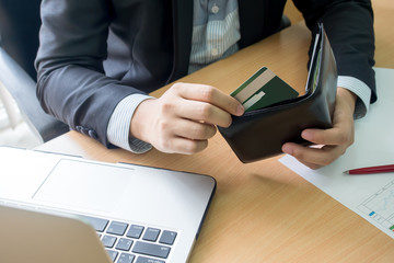 businessman bring credit card out from wallet for shopping online