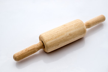 Wooden rolling pin on white background. Diagonal angle.