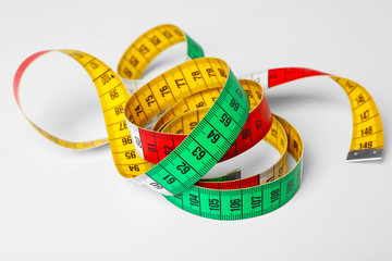 Measuring tape on white background