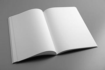 Blank open brochure on grey background