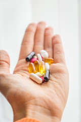 Pills in Woman’s Hand