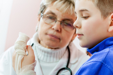 Doctor examining a child in a hospital