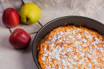 Apple pie with fresh fruits on light marble background