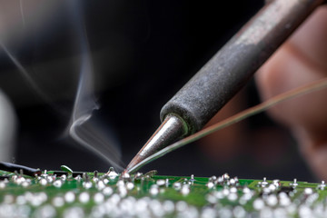 Fototapeta premium Repair of electronic devices, tin soldering parts