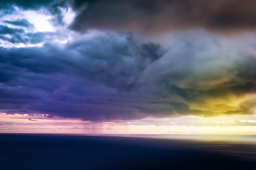 Fototapeta na wymiar Storm on Sea with Heavy Clouds. Long Time Exposure.