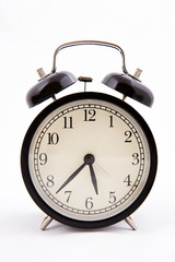 Black old style alarm clock with clipping path