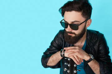 thinking rock guitar player on blue background