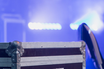flight case on stage Lighted by light projectors