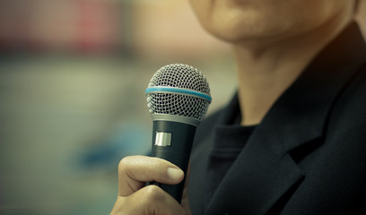 blurred of businessman speech, talking with microphone