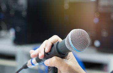 blurred of businessman speech with microphone