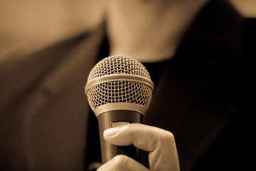 blurred of businessman speech, talking, public speaking with mic