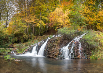 Waterfall in the forest in autumn
