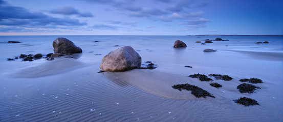 Coastal Sunset, Huge Boulders on Sand Beach, Baltic Sea