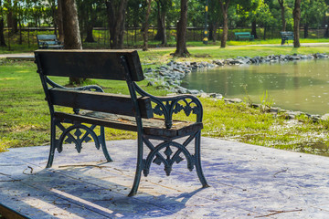 Empty Bench in the park for relaxing aisle.