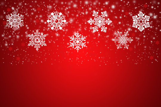 White snowflakes on an abstract red background