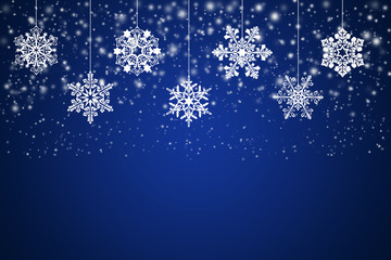 White snowflakes on an abstract blue background