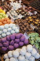 Colourful sweets: macarons,chocolate in a La Boqueria Market, Barcelona, Catalonia.