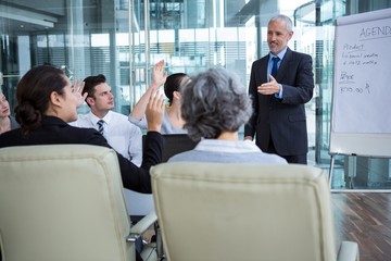 Businessman interacting with coworkers