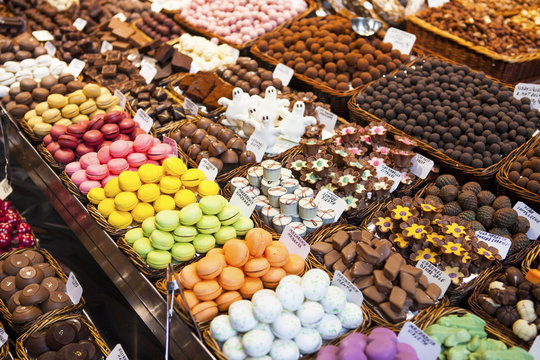 Colourful sweets: macarons,chocolate in a La Boqueria Market, Barcelona, Catalonia.