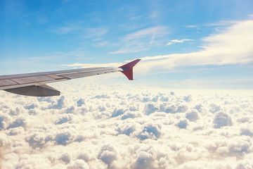 View from airplane window. Wing of an airplane flying above the