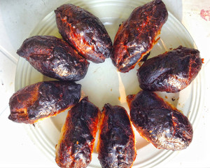 burnt pies with black crust on the plate