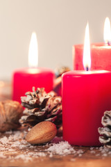 Christmas candles with christmas decorations, christmas or new year atmosphere, selective focus