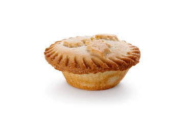 Close up of a Christmas Mince Pie and holly sprig isolated on a white background
