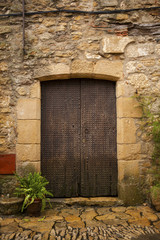 Antique door in old village of Peratallada, Catalonia, Spain