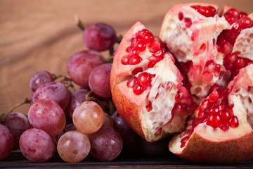 Ripe red grapes and pomegranate
