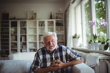 Senior man suffering from chest pain