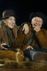 Two smiling hunters