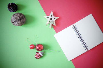 Flat lay of empty notebook and Christmas decorations