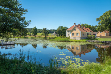 Fototapeta na wymiar Brevens bruk a small idyllic historic ironworks company town in Sweden