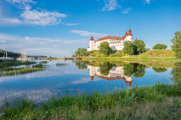 Summer evening by Lake Vanern and Lacko Castle. Lacko Castle is considered as one of the most beautiful castles in Sweden.