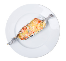 Foiled chicken fillet with cheese and vegetables.