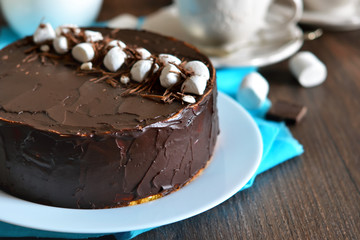 Homemade cake with vanilla mousse and chocolate decorated with c