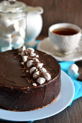 Homemade cake with vanilla mousse and chocolate decorated with c