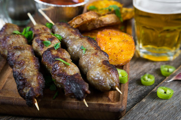 Kebab, fried potatoes and beer