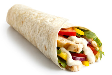 Grilled chicken and salad tortilla wrap with white sauce. - obrazy, fototapety, plakaty