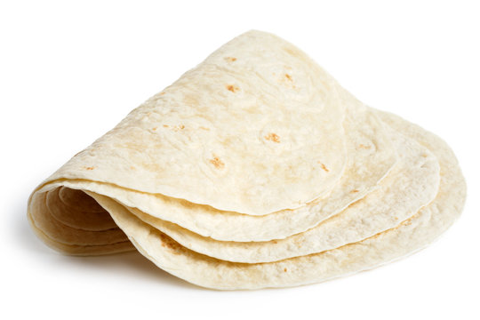Stack of folded tortilla wraps  isolated on white.
